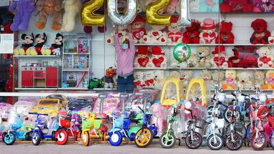 A vendor decorates his toy store ahead of the New Year in Kuwait City. AFP