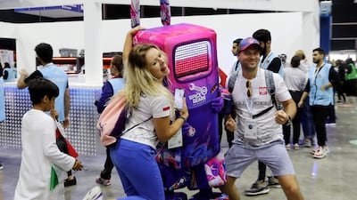 Visitors have their photos taken with the mascot.