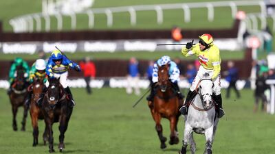 Harry Skelton, right, celebrates after guiding Politologue to victory in the Queen Mother Champion Chase at the Cheltenham Festival on Wednesday. Getty
