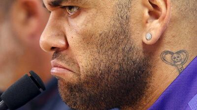 Barcelona's Dani Alves listens to a question during a news conference after a training session at the Barcelona training grounds Ciutat Esportiva Joan Gamper in Sant Joan Despi near Barcelona, Spain, May 25, 2015. REUTERS/Gustau Nacarino