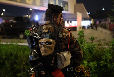 A member of Iraq's Popular Mobilisation Forces stands guard at a remembrance ceremony in Baghdad for the late Hezbollah leader Hassan Nasrallah, who was killed in an Israeli air strike in September 2024. EPA