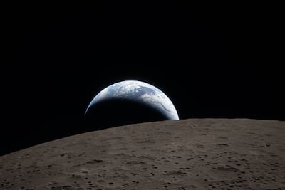 Earth photographed from the far side of the Moon, which is in the foreground, in an image taken from the Orion spacecraft. EPA / Nasa
