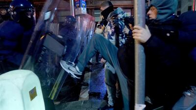 Irish riot police hold the line. PA