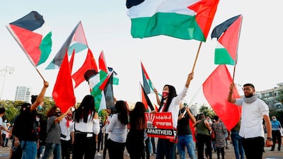 Protesters gather in Tel Aviv's Rabin Square on June 6, 2020, to denounce Israel's move to annex parts of the occupied West Bank amid Prime Minister Benjamin Netanyahu's vow to forge ahead with US President Donald Trump's Middle East peace plan. AFP