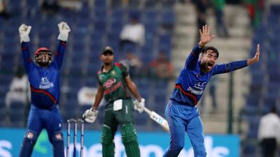 Rashid Khan led Afghanistan to victory over Bangladesh in the Asia Cup group stages and will look to repeat his heroics on Sunday. Chris Whiteoak / The National