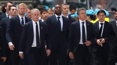 Leicester City manager Claude Puel and his players arrive to pay respect the team's late Chairman Vichai Srivaddhanaprabha. EPA