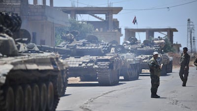 Forces loyal to Syria's President Bashar Al Assad are deployed in Al Ghariya in Deraa province. Sana via Reuters