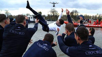 Jack Tottem, the University of Oxford team's coxswain, is thrown into the River Thames after victory over rivals Cambridge in the Gemini Boat Race in London. Getty Images
