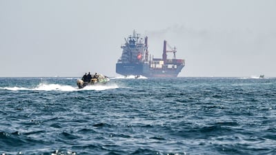 A ship in the Strait of Hormuz. US struck Iranian targets and Tehran launched retaliatory strikes on its Gulf neighbours Bahrain and Kuwait over the weekend. AFP