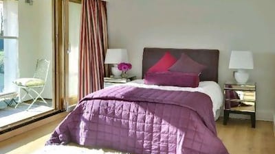 Vibrant splashes of colour are achieved through furnishing and decoration rather than paint.