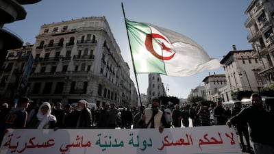 Algerian demonstrators take to the streets in to protest against the government and the upcoming presidential elections, in Algiers, Algeria. AP Photo