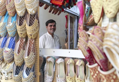 Ashfaq Ali is part of thriving family enterprise in the heart of Dubai's historic Al Fahidi district. Chris Whiteoak / The National