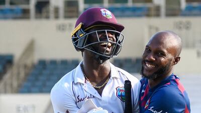 Kemar Roach, left, and Jermaine Blackwood celebrate West Indies' one-wicket win against Pakistan in the first Test at Sabina Park, Kingston.