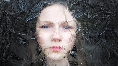 'My daughter photographed behind a glass door during lockdown.' Simon Murphy/NPG