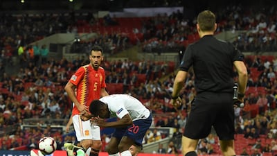 England substitute Danny Welbeck, centre, scores a goal that is later disallowed for a foul on Spain goalkeeper David de Gea. EPA