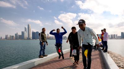 A balloon relay along the Corniche in Abu Dhabi to welcome 2023. Victor Besa / The National