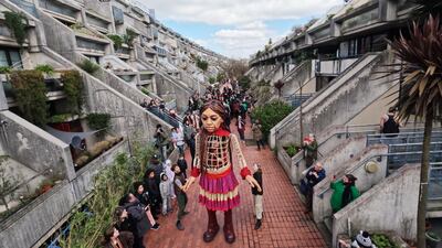 Little Amal – part of a 2021 performance art piece called 'The Walk' – visits the Alexandra and Ainsworth Estate in London. Getty Images