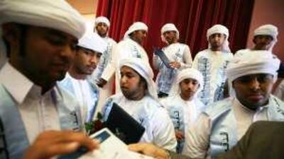 Emiratis who had dropped out of school receive their certificates at a vocational educational centre.