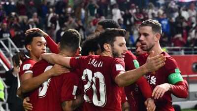 Roberto Firmino (L) celebrates with his Liverpool teammates. EPA