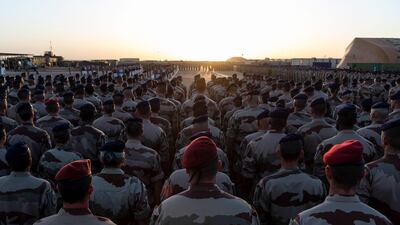 Troops at the French Army base in Gao, Mali, remember the 13 killed in the collision. AFP