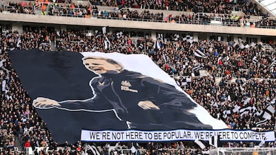 Newcastle fans unveil a flag of manager Eddie Howe before the match. Getty
