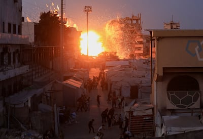 Smoke and flames rise after an Israeli air strike in Gaza city. Reuters