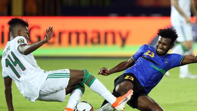Hicham Boudaoui, left, of Algeria is challenged by Mudathir Yahya of Tanzania. EPA
