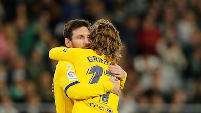 Lionel Messi celebrates with Antoine Griezmann. Reuters