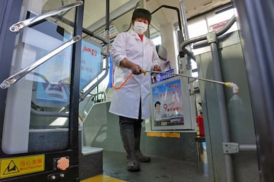 Disinfectant is sprayed on a bus in Yantai to prevent Covid-19. AFP