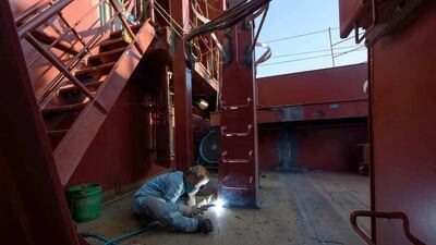 A welder works on an under-construction Maersk triple-E class container ship at the Daewoo DSME shipyard in Okpo, 60km south of Busan, South Korea. At some 400 metres long and capable of carrying over 18,000 containers, triple-E class ships are the largest currently in operation. Expected to be deployed on Maersk’s Asia - Europe routes, the ships use a combination of engine technology and a slower cruising speed to reduce fuel consumption and emissions, and are touted as being considerably more efficient than rival classes. Ed Jones / AFP