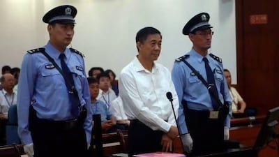 Bo Xilai, centre, stands trial at the court in eastern China's Shandong province on Thursday.