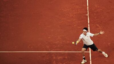 Kei Nishikori retired with a lower back injury at Madrid but rose to No 10 in the ATP rankings. Dani Pozo / AFP