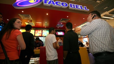 Customers at Taco Bell in Dubai Mall. The fast food brand operated in the UAE from 2008 until 2012. Nicole Hill / The National