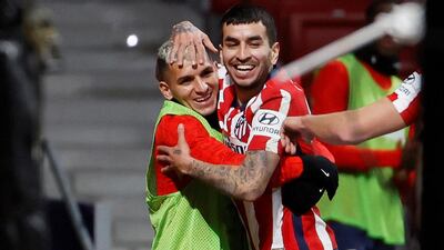 Atletico's striker Angel Correa celebrates with his teammate Lucas Torreira. EPA