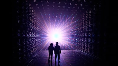 Members of the media look at the newly unveiled Light Sculpture installation during a press review at Azabudai Hills in Tokyo. EPA