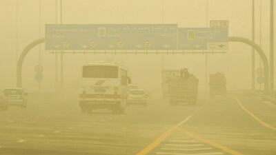 High winds and dust make driving on Skeikh Mohammed bin Zayed Rd a dangerous endeavour. Charles Crowell for The National