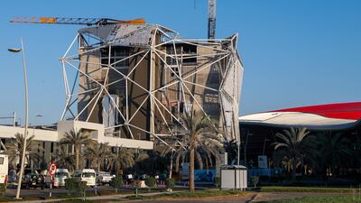 Fire damage marks two cranes at the Clymb Abu Dhabi construction site on Yas Island following a fire last month. The National