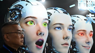 A man stands next to a poster showing robots mimicking human expressions during the International AI Application and Robotics Innovation Exhibition in Beijing on March 18. AFP