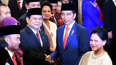 Prabowo Subianto, left, has been included in President Joko Widodo's cabinet despite being political rivals. Reuters