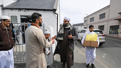 Aihtsham Rashid greets Iman Mufti Abdur Rahman Mangera at the opening of the first mosque built on the Western Isles, Stornoway, Scotland, on May 11, 2018. The former derelict building has been converted into the UK's most northern mosque, following a fundraising campaign which raised more the fifty nine thousand pounds towards construction costs. Jeff J Mitchell / Getty Images