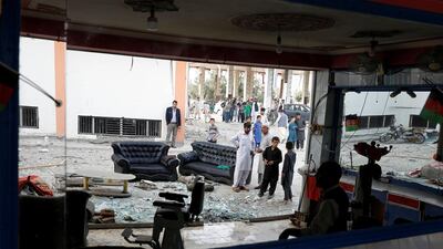 Residences are reflected in a mirror of a damaged barber shop after Sunday's attack in Kabul, Afghanistan. REUTER