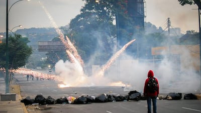 Students clash with the riot police as they protest against the government of Venezuelan President Nicolas Maduro in Caracas. Street protests erupted in Venezuela on February 4 and have continued every day since. (Manaure Quintero / AFP Photo / March 7, 2014)