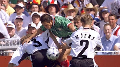 Mexican forward Cuauhtemoc Blanco (C) jumps between German Jorg Heinrich (L) and Christian Woerns 29 June at the Stade de la Mosson in Montpellier, south of France, during the 1998 World Cup s match between Germany and Mexico. AFP / PATRICK HERTZOG