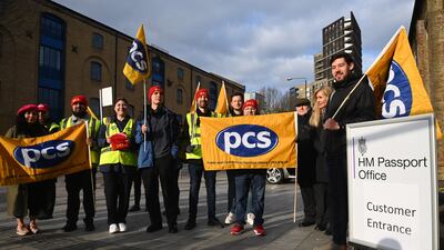 Members of the Public and Commercial Services union picket outside HM Passport Office in London. More than 1,000 members of PCS working in passport offices across the country began a five-week strike on Monday. EPA
