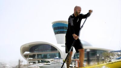 The general manager of Yas Marina Cedric Le Rest described his day's work in a story published on June 7. Above, Mr Le Rest enjoys one of his favourite hobbies, stand up paddleboarding. Christopher Pike / The National