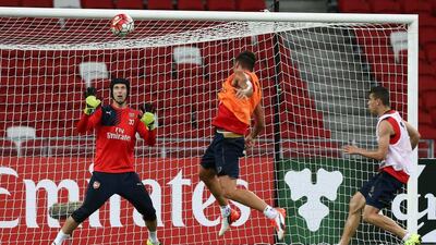Petr Cech takes part in pre-season training with Arsenal ahead of the Barclays Asian Trophy in Singapore. Stanley Chou / Getty