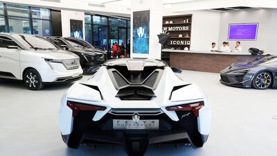 Two Fenyr SuperSports with two Iconiq Seven electric MPVs. Pawan Singh / The National