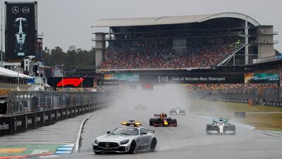 The cars ran behind the safety car for the first three laps. EPA
