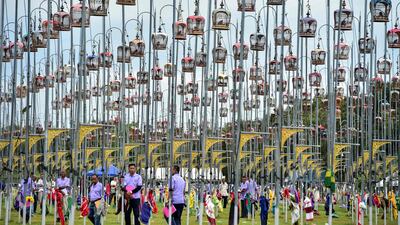 Birds sit in cages during a bird singing competition in Thailand's southern province of Narathiwat. AFP