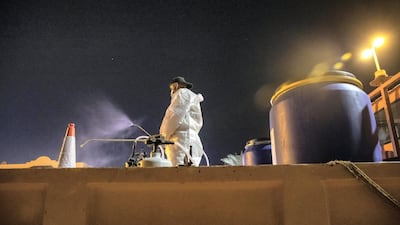 Sharjah Municipal staff prepare to spray and disinfect the sidewalk along the Al Muntazah Street area.
